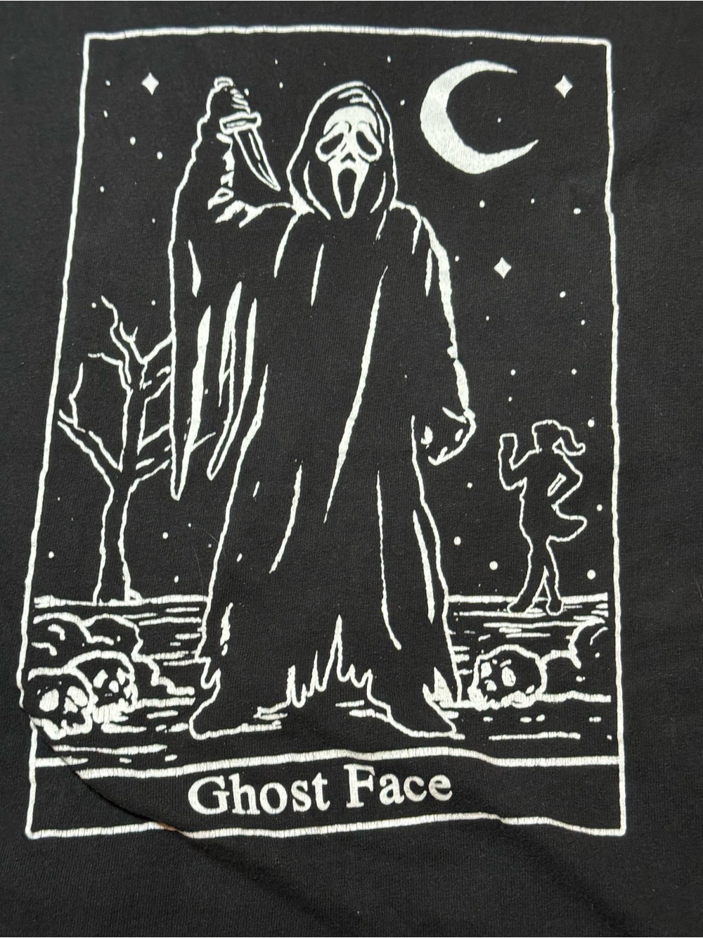 Spencer's Black T‑Shirt with White Ghost Face Graphic